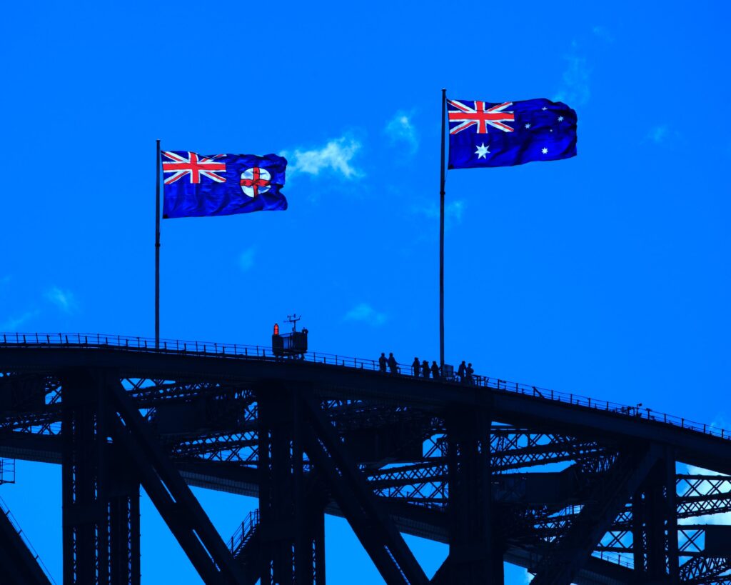 Sydney bridge with Australian flag